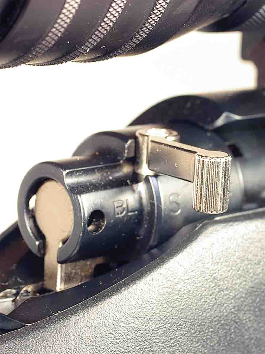 The T/C Compass has a three-position safety. Set in the middle position, it still engages the safety but allows opening the bolt.